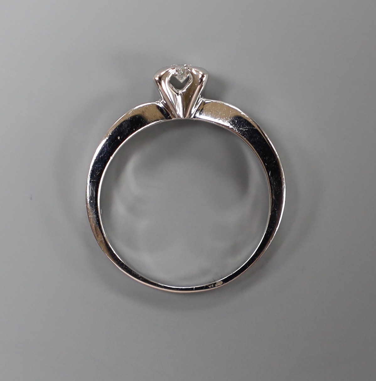 A modern platinum and single stone diamond set ring, size N, gross weight 6 grams